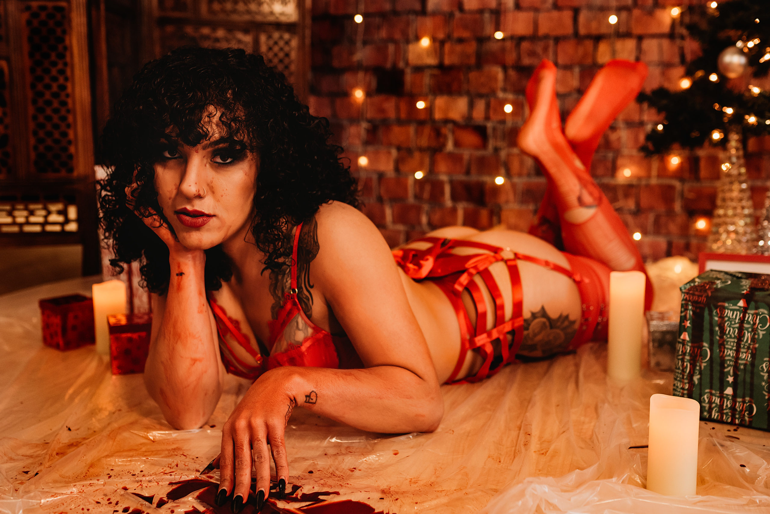 Editorial-style boudoir with bold pose and harness
