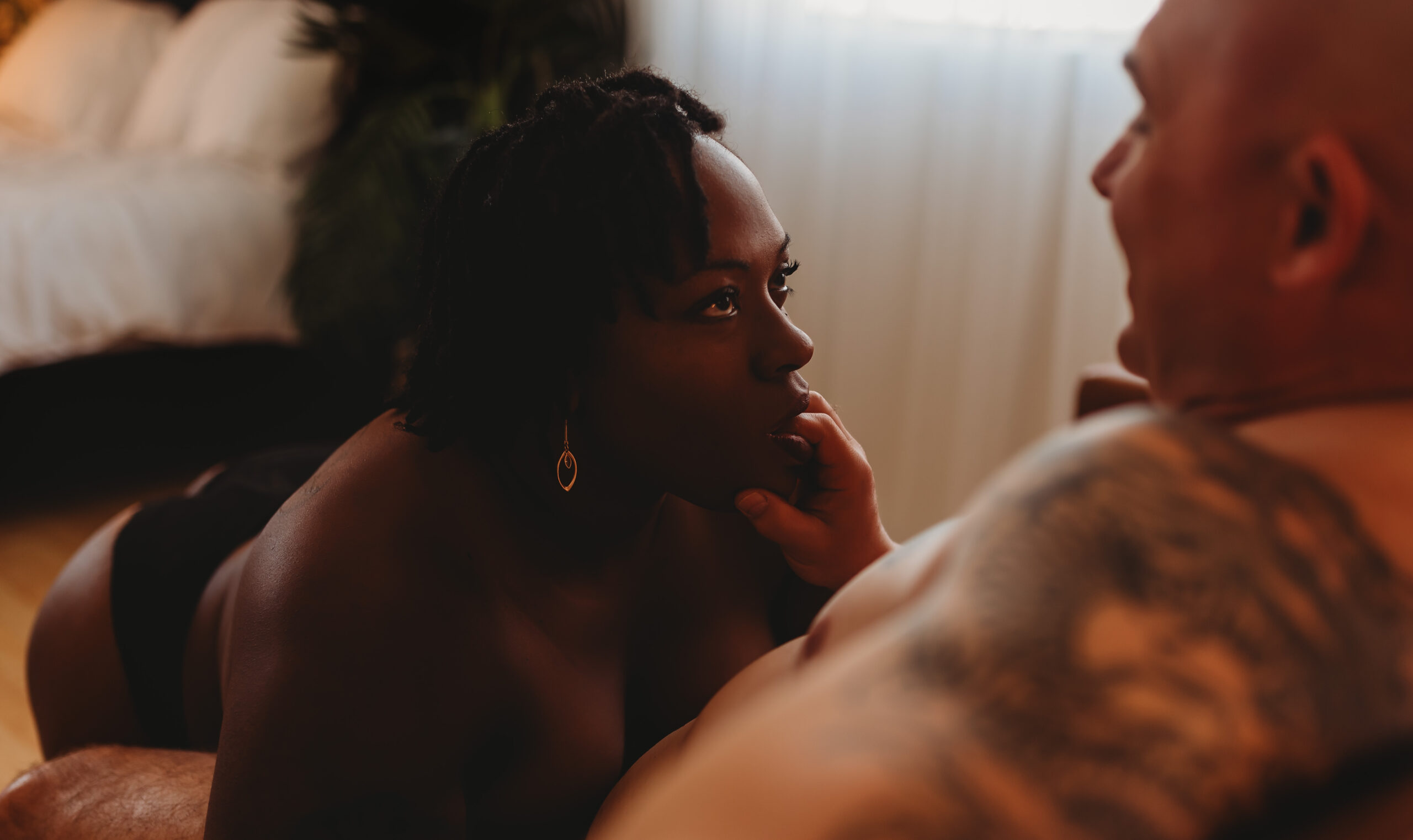 Intimate couples portrait on bed in El Dorado Hills studio